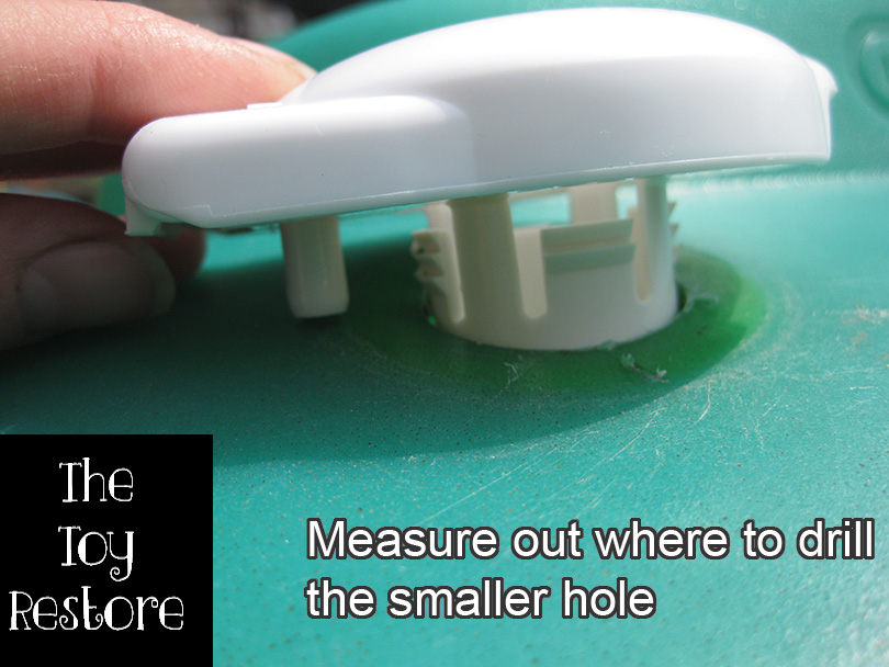 How To Fix Vintage Cozy Coupe Gas Cap : Measure out there to drill the smaller hole for the Little Tikes Ride-On